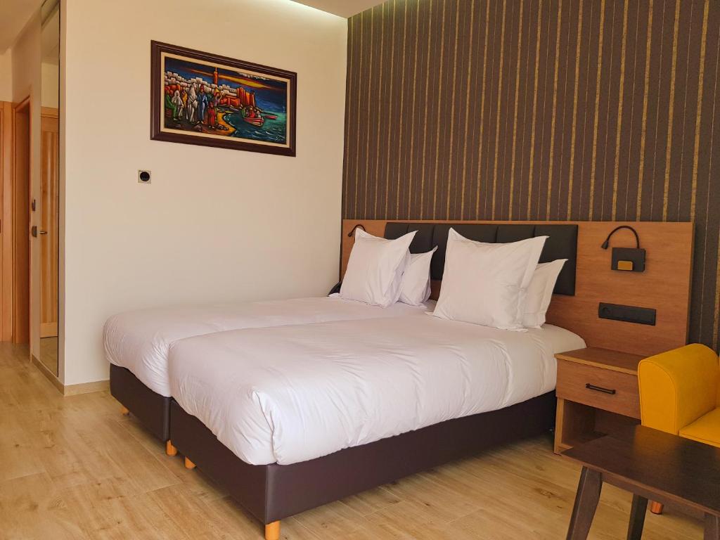 Postel nebo postele na pokoji v ubytování Surf One Hotel