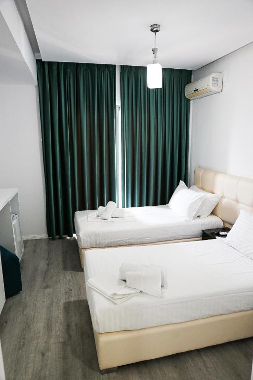 Postel nebo postele na pokoji v ubytování Hotel Aloha