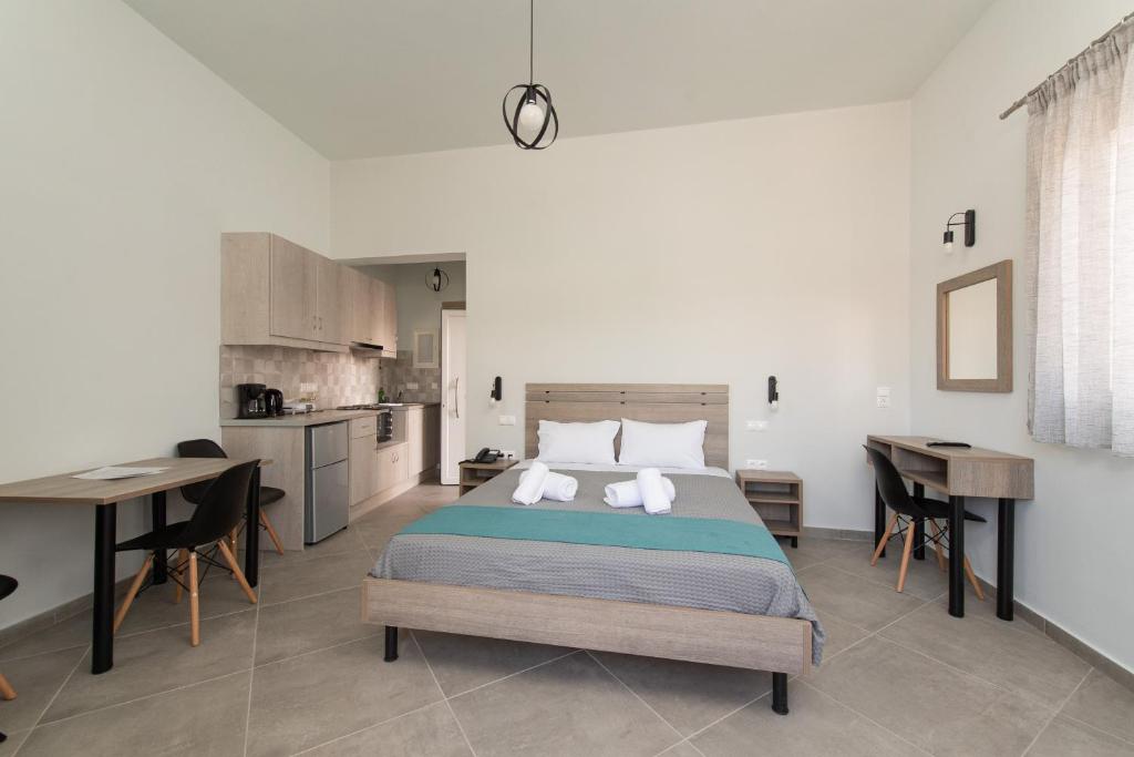 Postel nebo postele na pokoji v ubytování Loggos Apartments