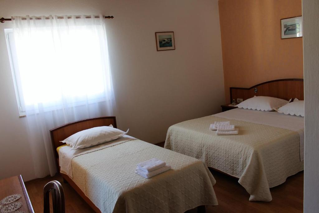 Postel nebo postele na pokoji v ubytování Apartment BenTen