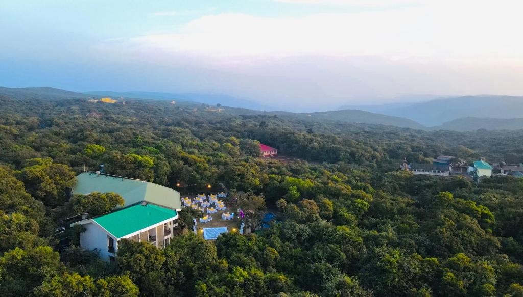 an aerial view of a building in the middle of a forest at Tranquil Resort & Spa in Mahabaleshwar