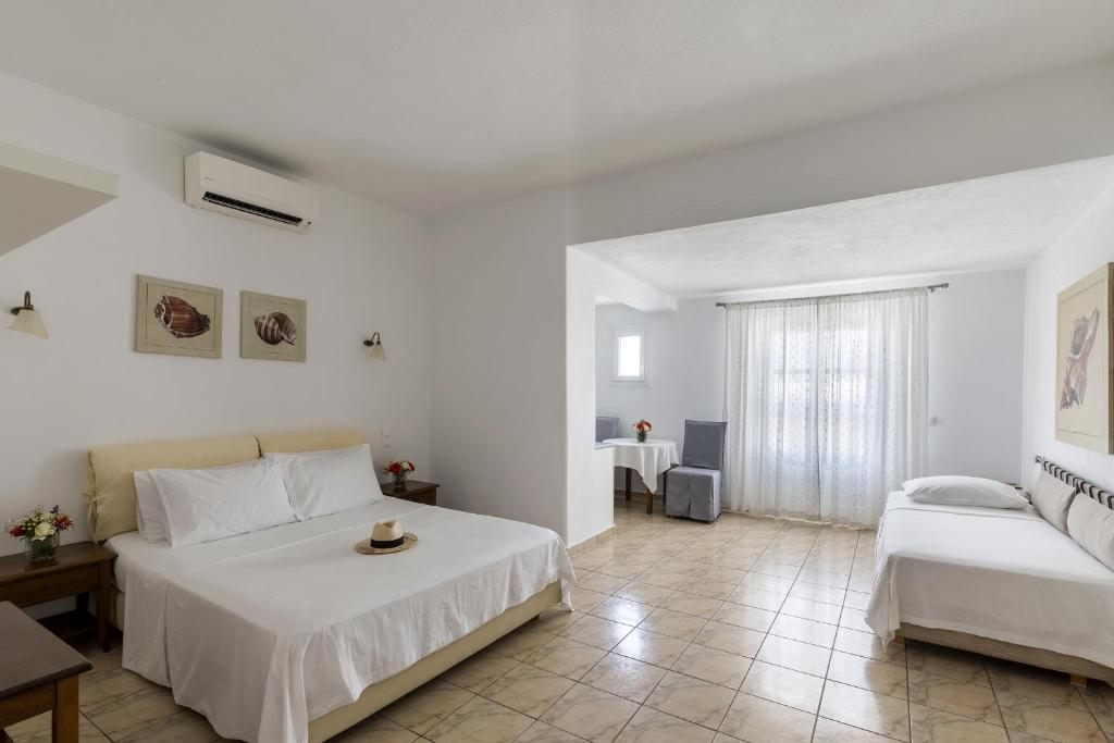 Postel nebo postele na pokoji v ubytování Marisso Hotel