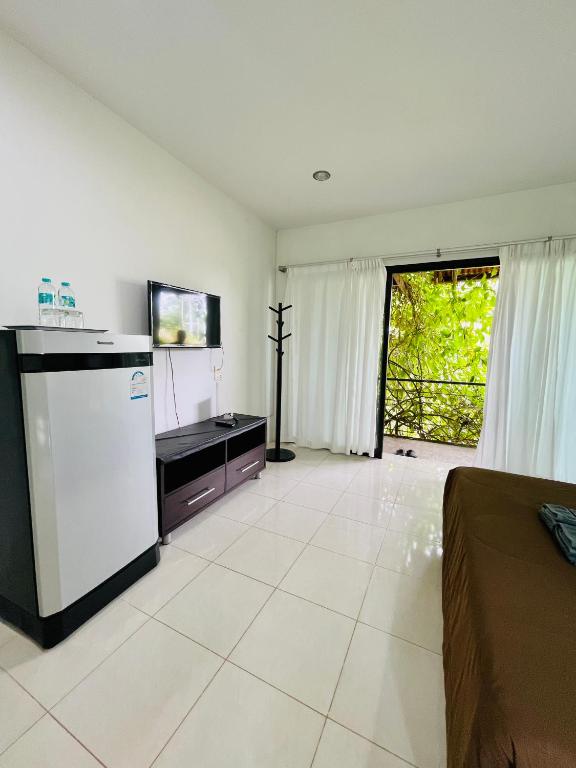 Wassana Sitdharma Guesthouse - Deluxe Double Room