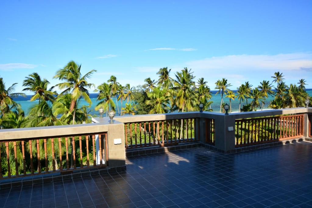 a view of the ocean from the balcony of a resort at Zanoceanique Hotel in Matemwe