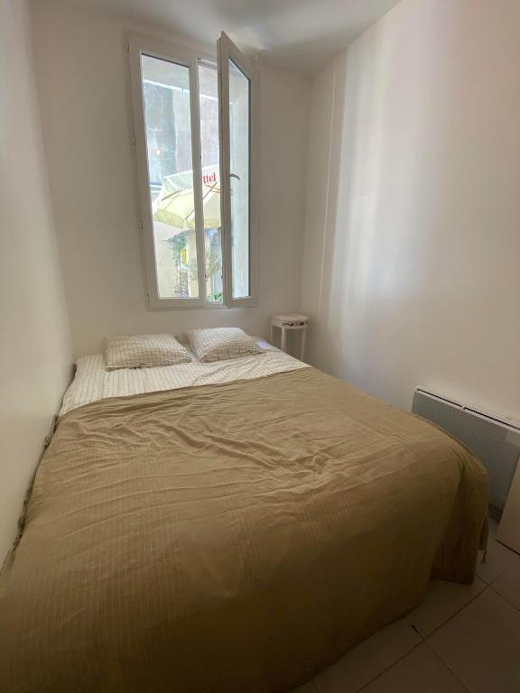 Posteľ alebo postele v izbe v ubytovaní Charmant appartement grande terrasse