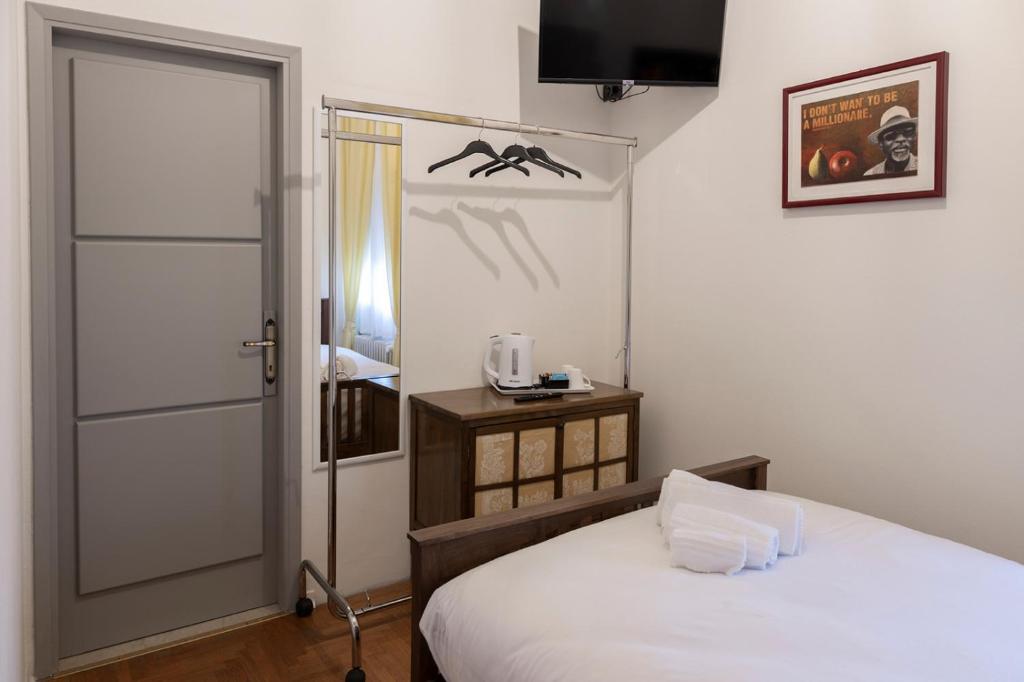 Postel nebo postele na pokoji v ubytování Seven Suites Pieve