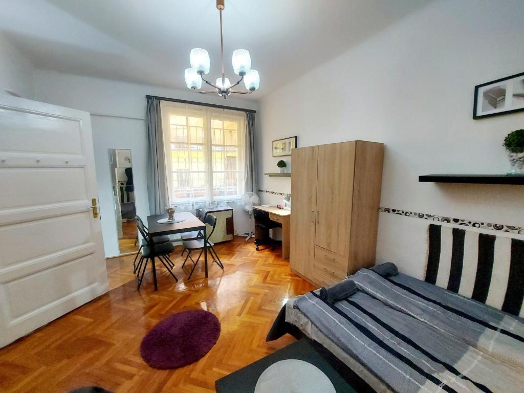 Posteľ alebo postele v izbe v ubytovaní Gecko Centrum Studio Apartman