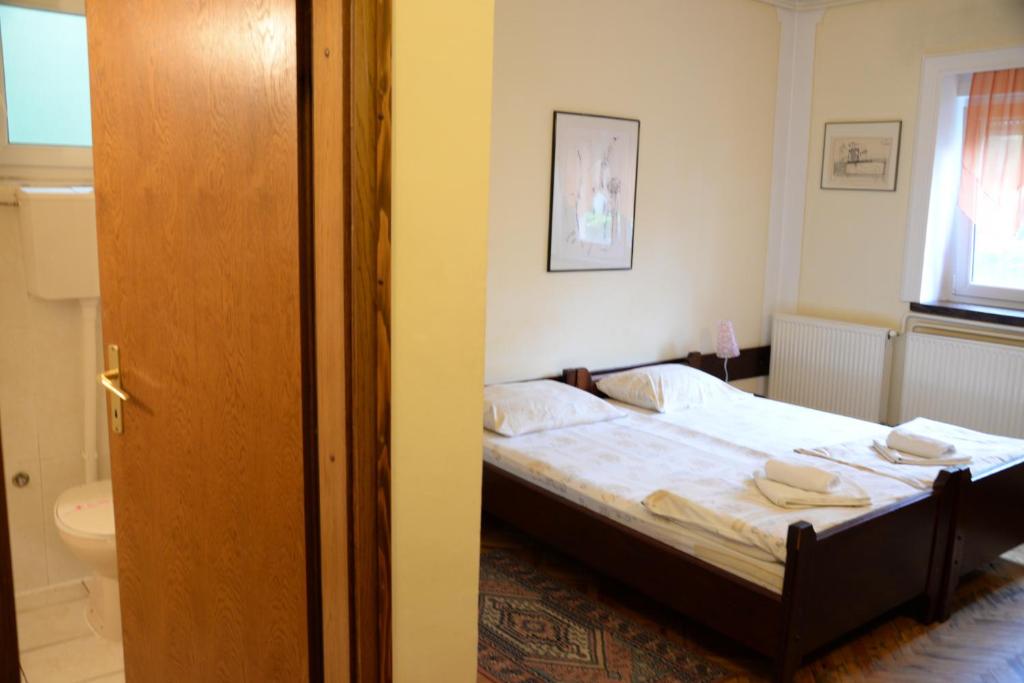 Postel nebo postele na pokoji v ubytování Vila Regina