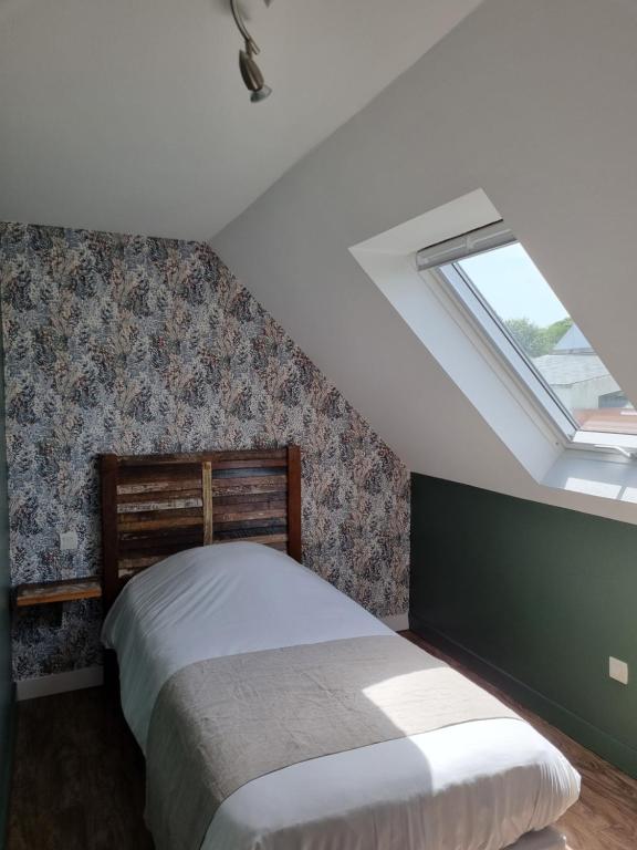 Postel nebo postele na pokoji v ubytování Hôtel Vauban