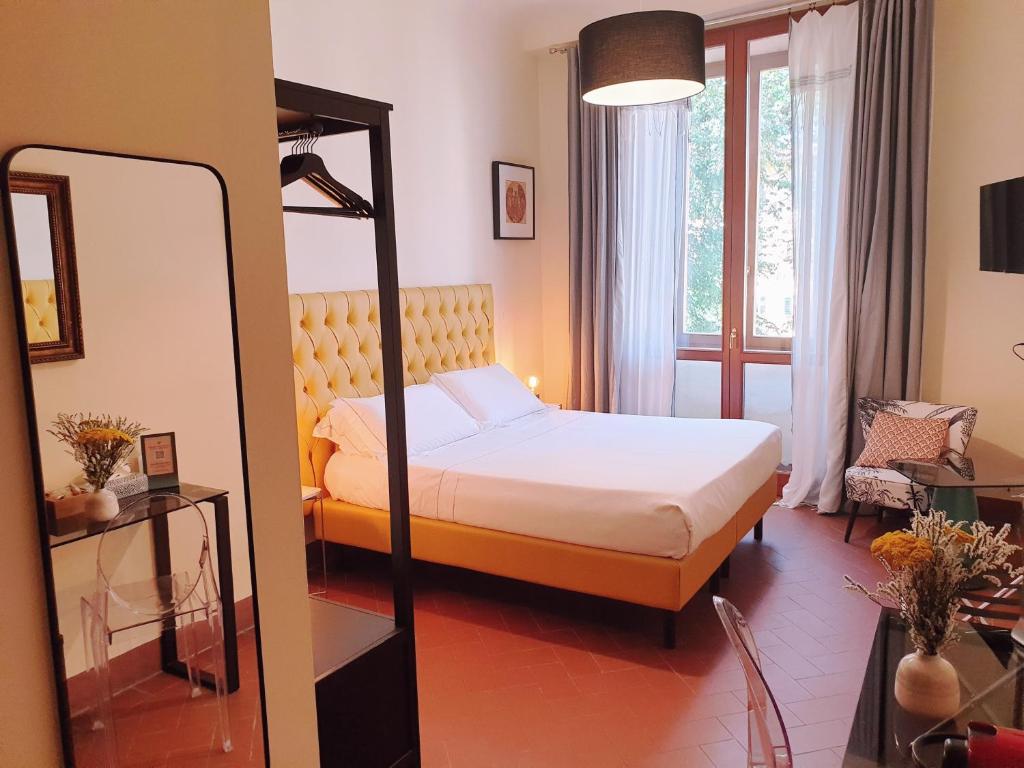 Postel nebo postele na pokoji v ubytování SPIRIT OF FLORENCE Boutique Rooms