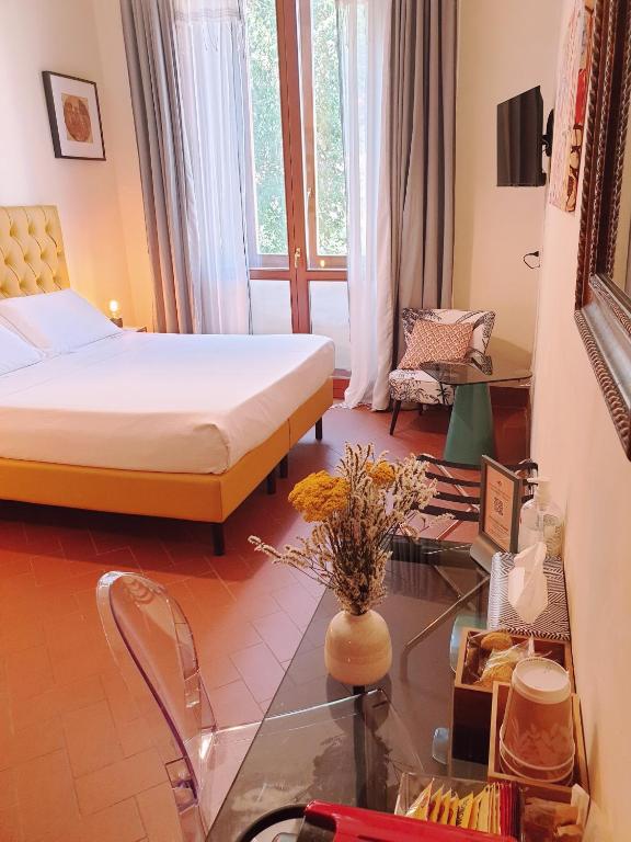 Postel nebo postele na pokoji v ubytování SPIRIT OF FLORENCE Boutique Rooms