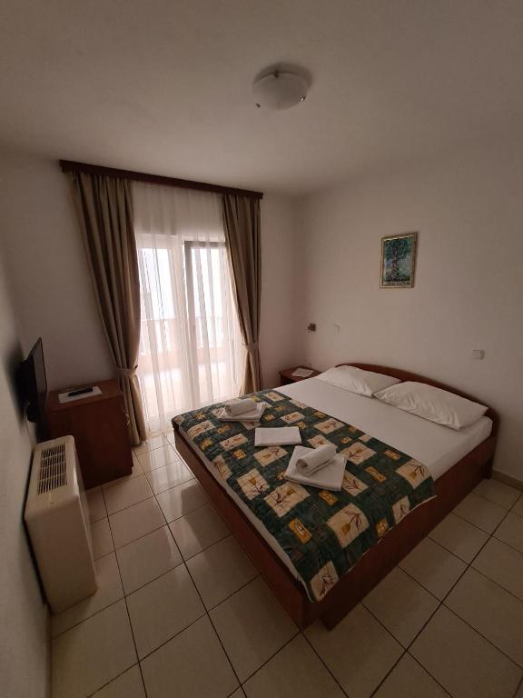 Postel nebo postele na pokoji v ubytování Villa Ancora