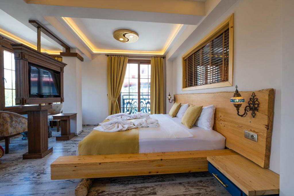 Postel nebo postele na pokoji v ubytování Reis Royal Hotel