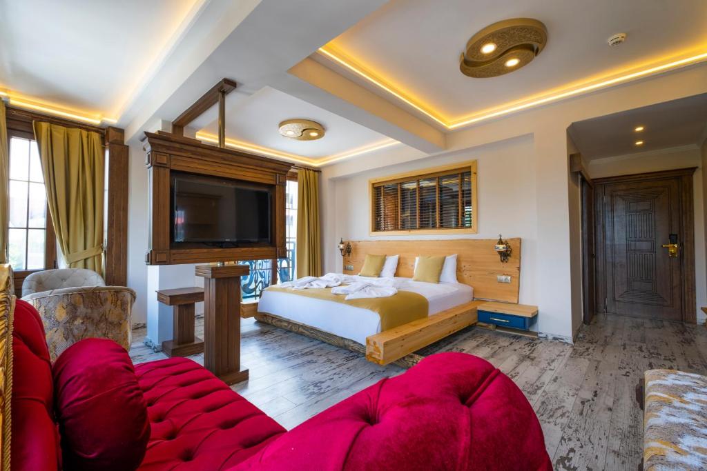 Postel nebo postele na pokoji v ubytování Reis Royal Hotel