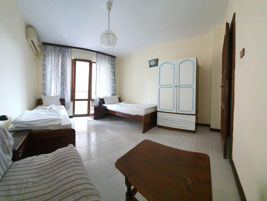 Postel nebo postele na pokoji v ubytování Lazur Hotel