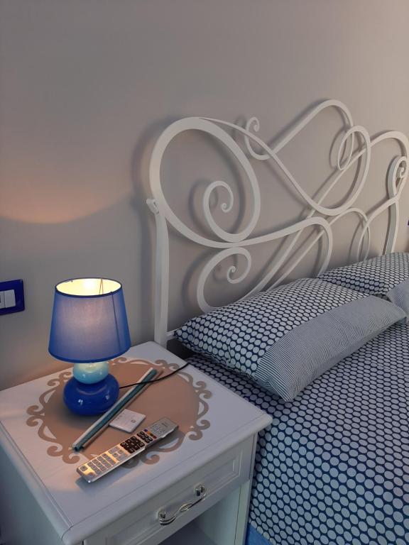 Postel nebo postele na pokoji v ubytování Santa Margherita Suite - CHIAIOLELLA