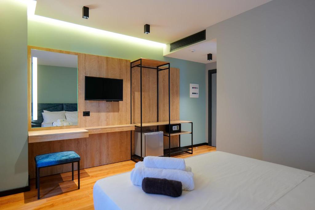 Postel nebo postele na pokoji v ubytování Seawave Hotel