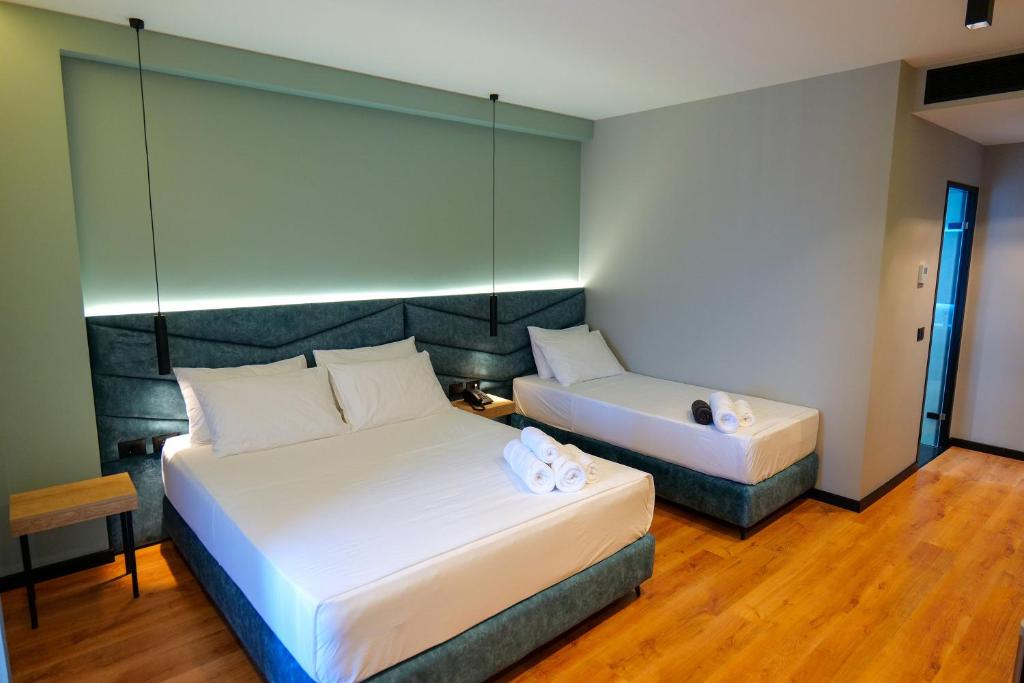Postel nebo postele na pokoji v ubytování Seawave Hotel