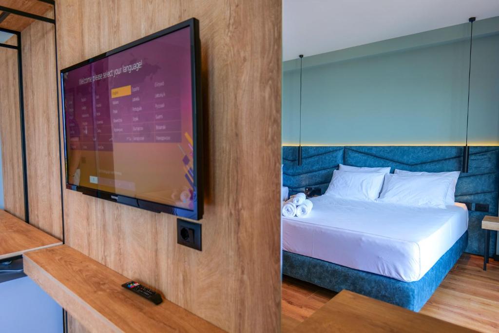 Postel nebo postele na pokoji v ubytování Seawave Hotel