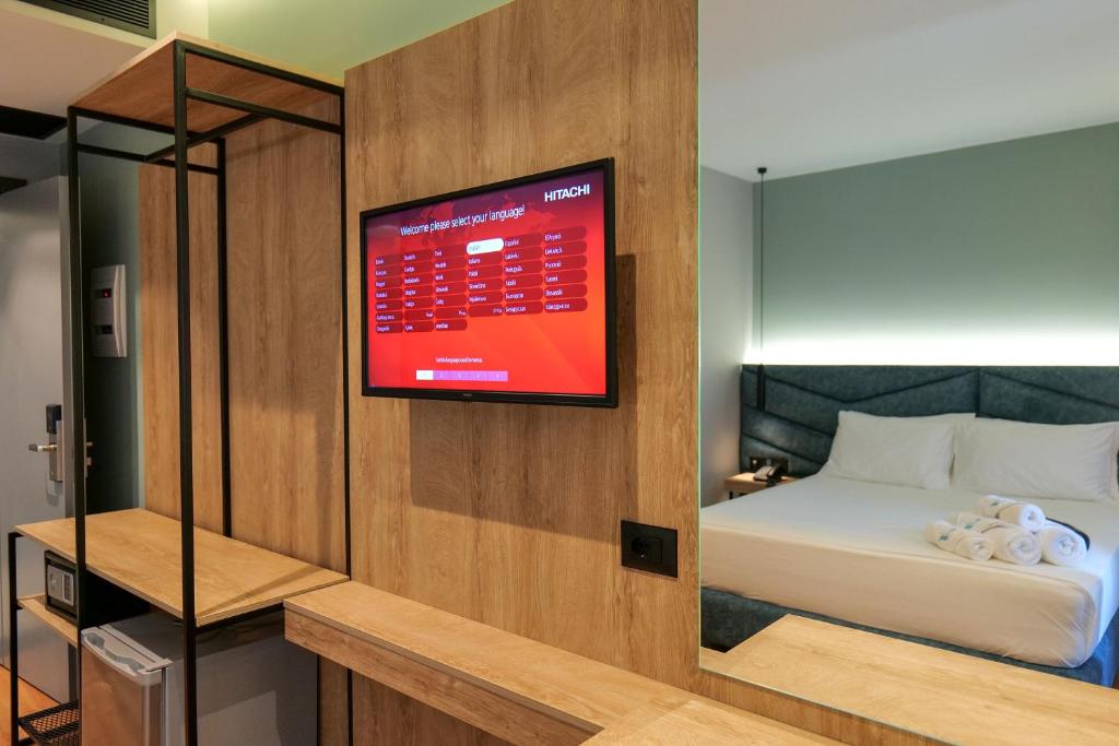Postel nebo postele na pokoji v ubytování Seawave Hotel