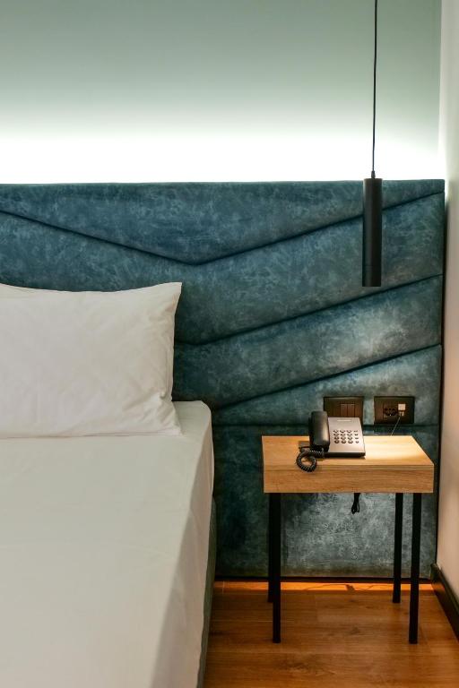 Postel nebo postele na pokoji v ubytování Seawave Hotel