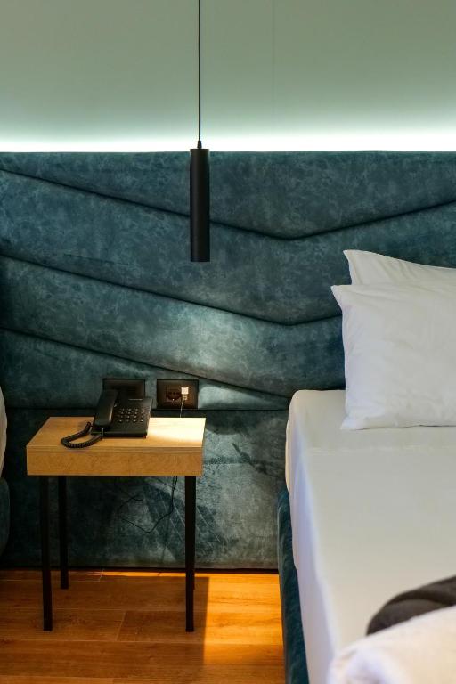 Postel nebo postele na pokoji v ubytování Seawave Hotel