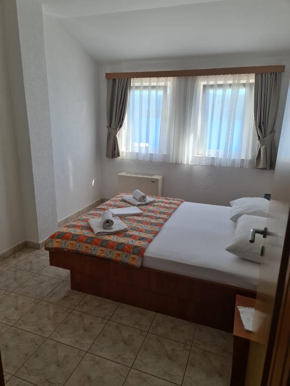 Postel nebo postele na pokoji v ubytování Villa Ancora