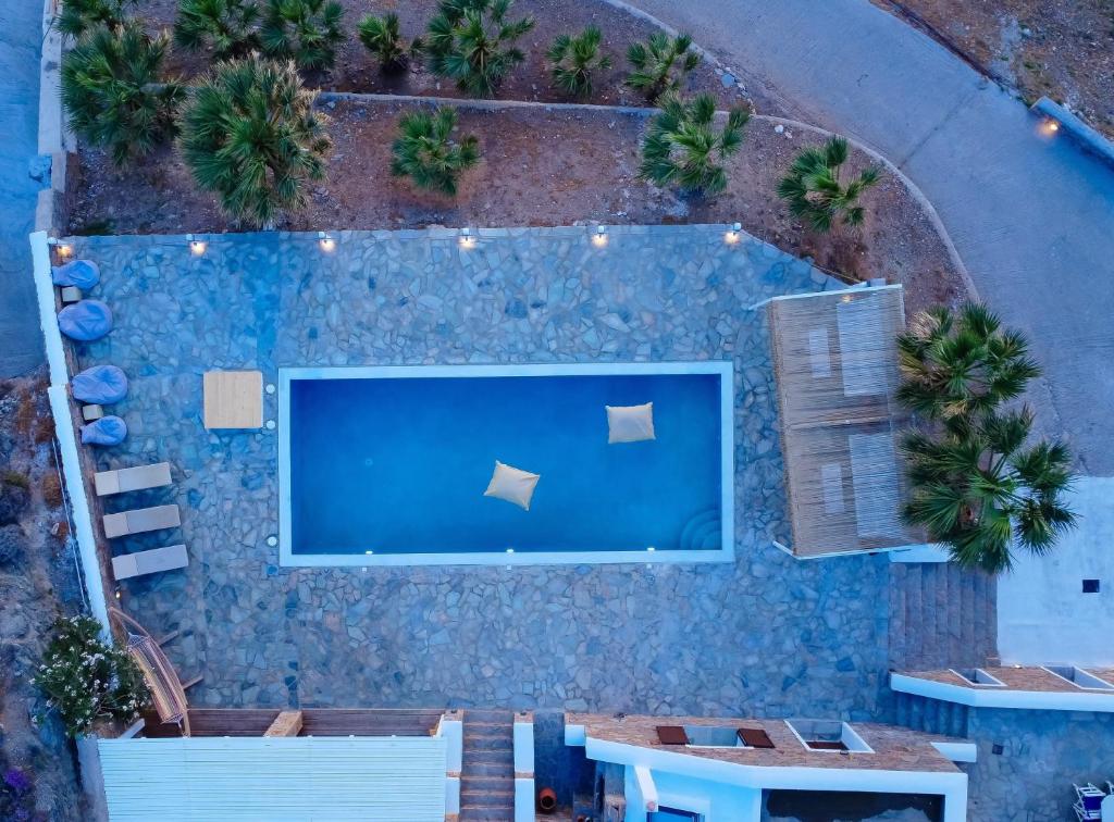 an overhead view of a swimming pool with a large screen television at Eternal Blue Kythnos in Mérikhas