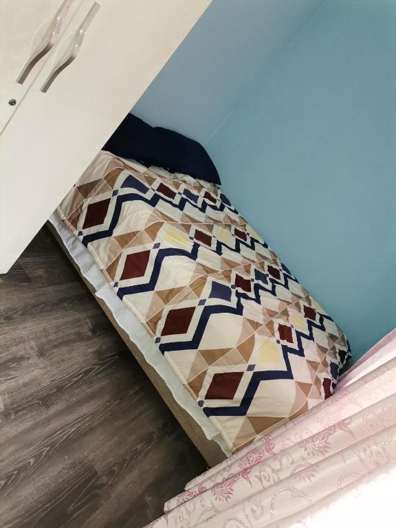 a bed in a box on the floor of a room at Graceful Seniors in Durban