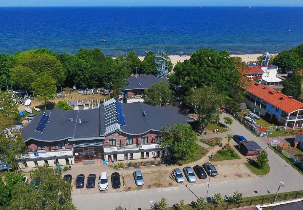 an aerial view of a large house with a parking lot at Yacht Club Residence Sopot in Sopot