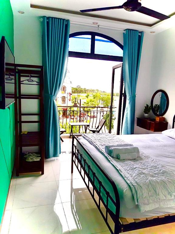 Postel nebo postele na pokoji v ubytování Lex Homestay Hotel