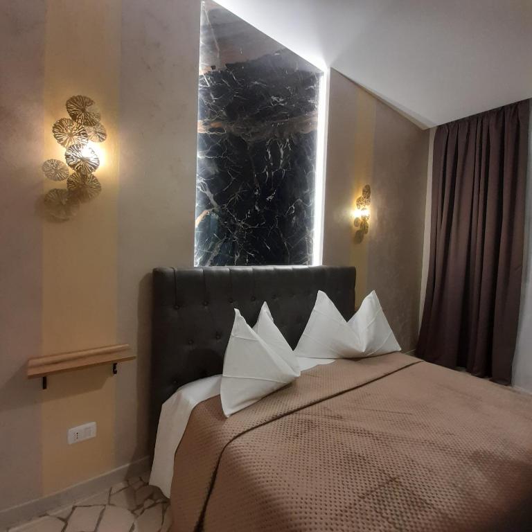 A bed or beds in a room at Residenza N&D Luxury