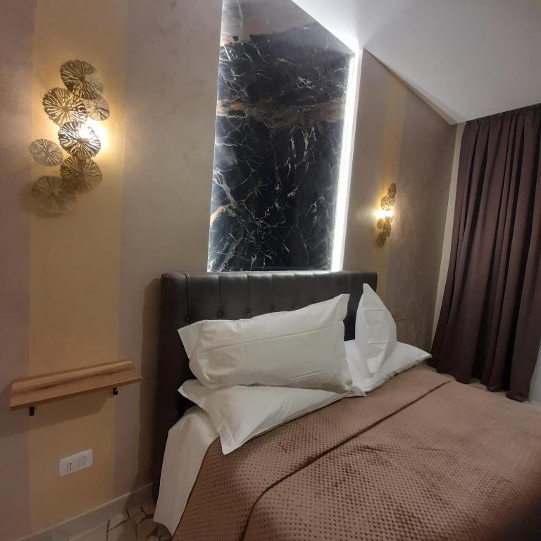 A bed or beds in a room at Residenza N&D Luxury