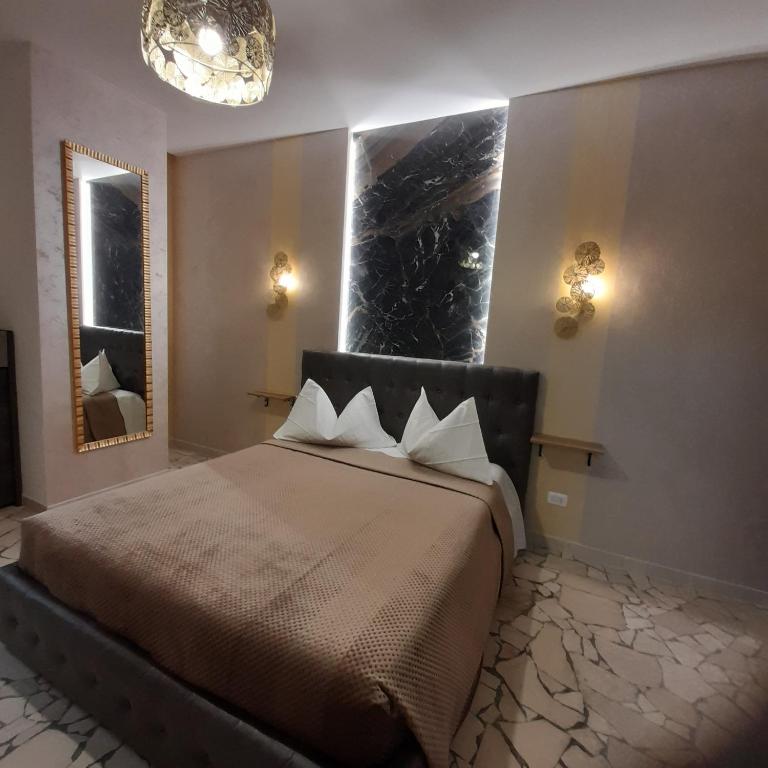 A bed or beds in a room at Residenza N&D Luxury