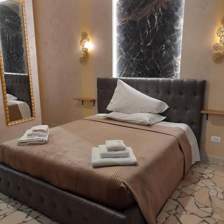 A bed or beds in a room at Residenza N&D Luxury