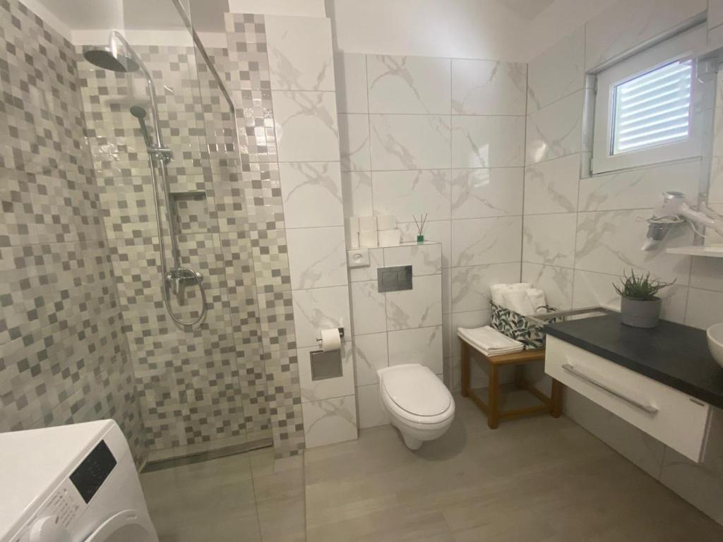 Koupelna v ubytování Apartman I & R