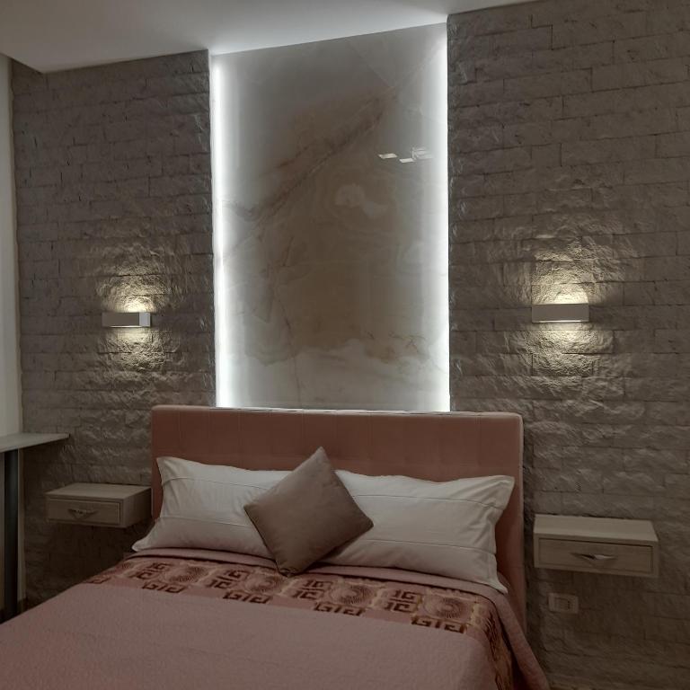 A bed or beds in a room at Residenza N&D Luxury