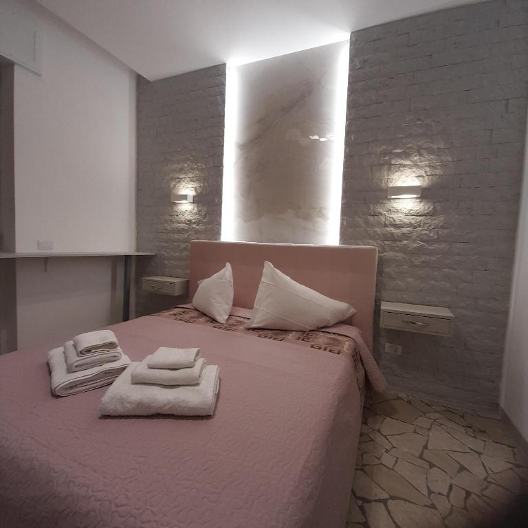 A bed or beds in a room at Residenza N&D Luxury
