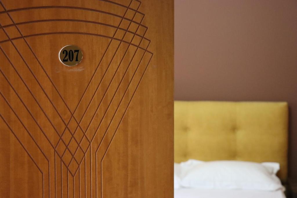 Postel nebo postele na pokoji v ubytování Hotel Ceka