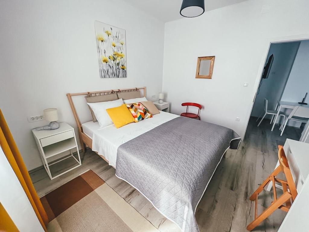 Posteľ alebo postele v izbe v ubytovaní Apartments Happy