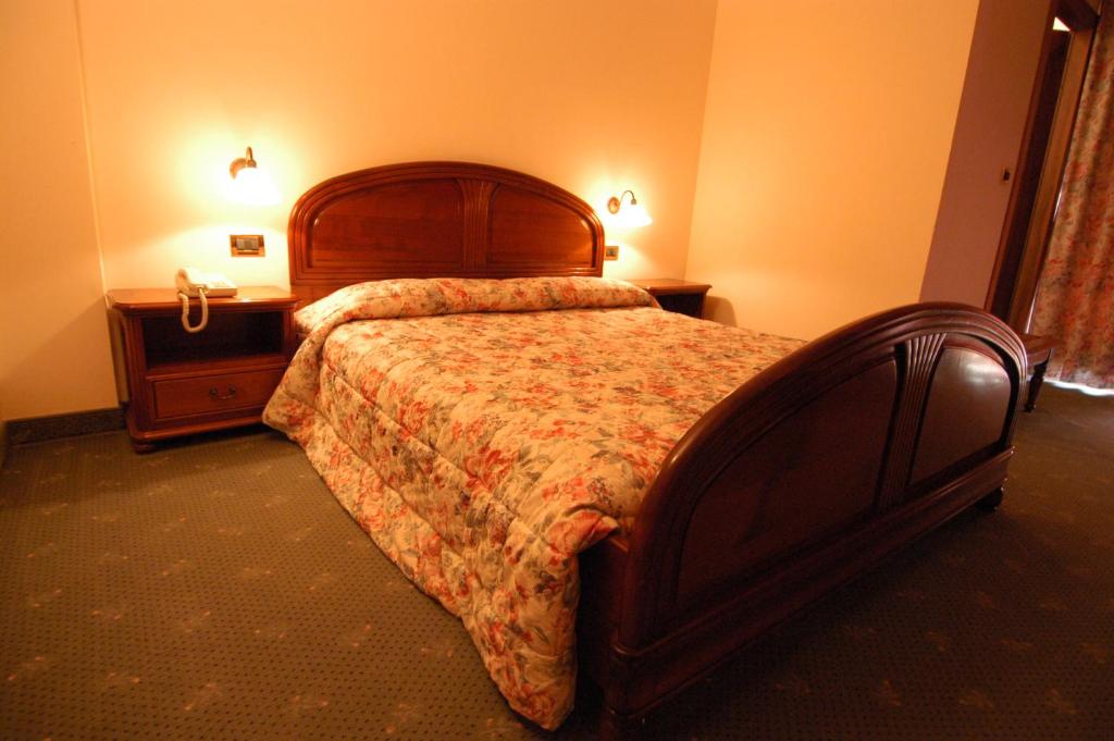 Postel nebo postele na pokoji v ubytování Hotel Panoramique