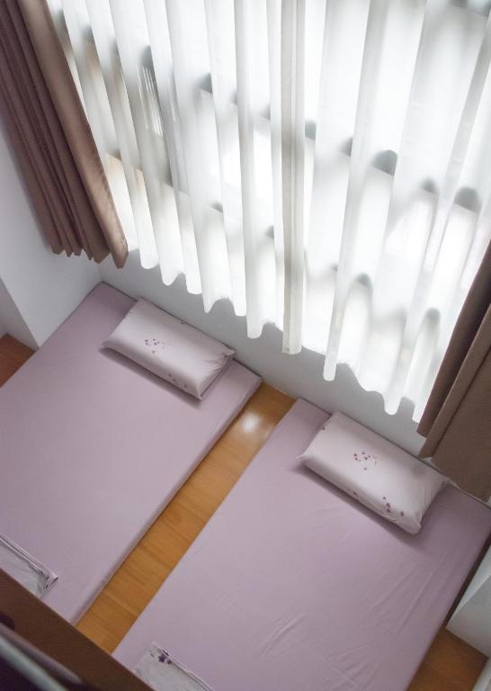 Postel nebo postele na pokoji v ubytování Hodua Guest House