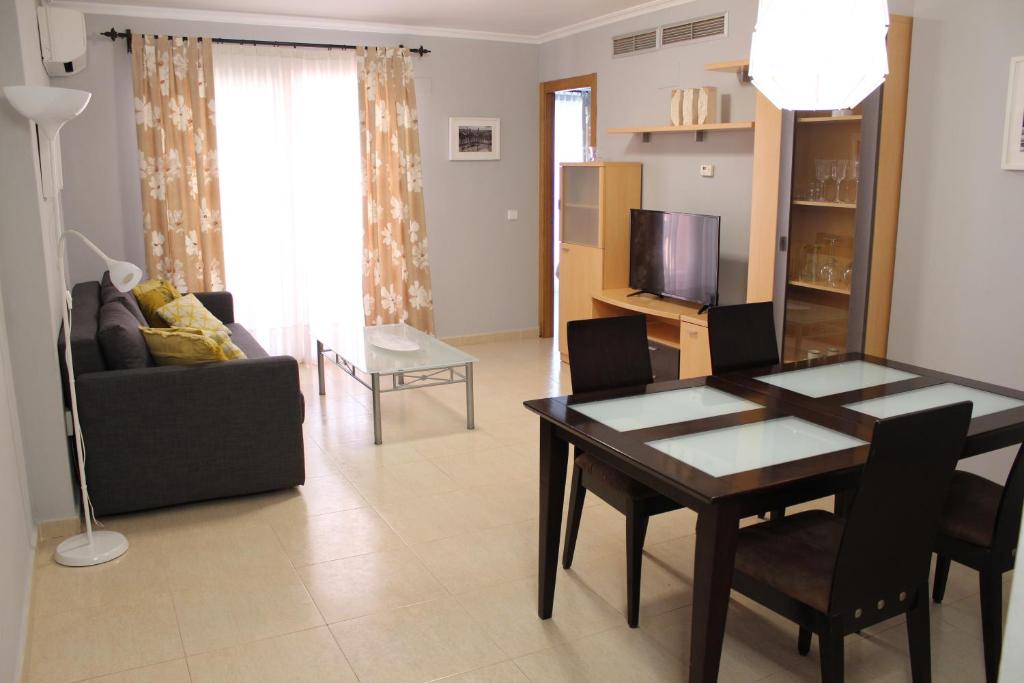 Posezení v ubytování Apto. con gran terraza y acceso directo a piscina.