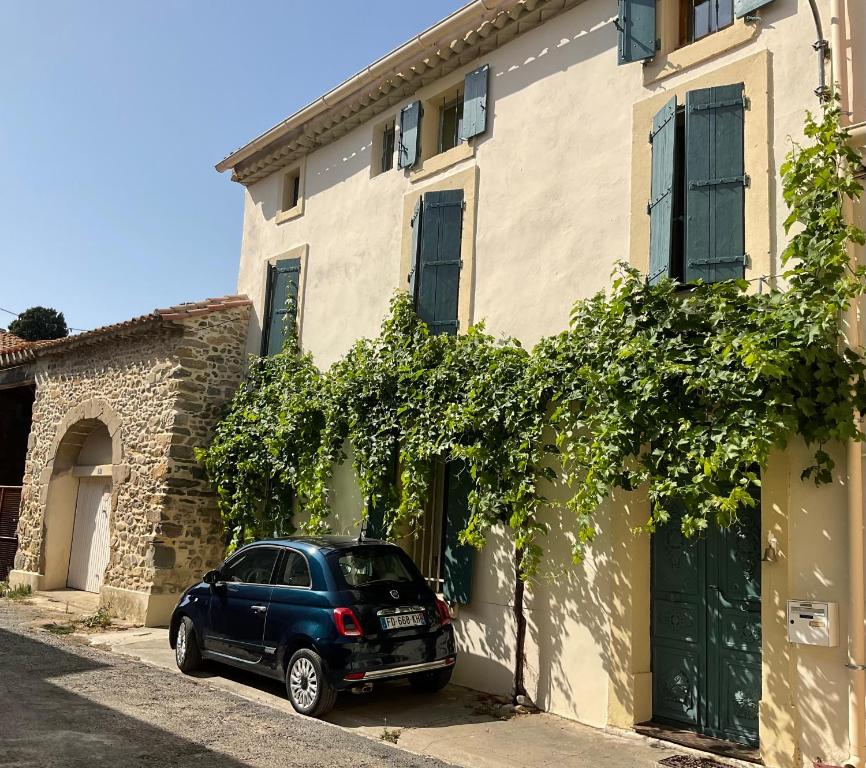 a car parked in front of a building at La Souqueto in Mirepeisset