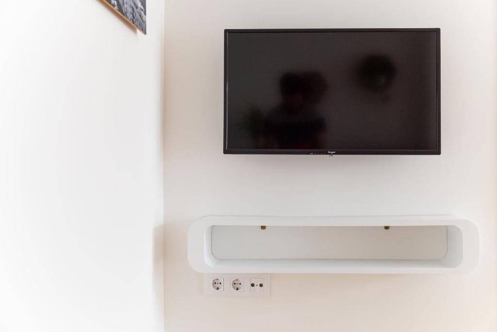 TV a/nebo společenská místnost v ubytování Apartamentos Manuel Roio