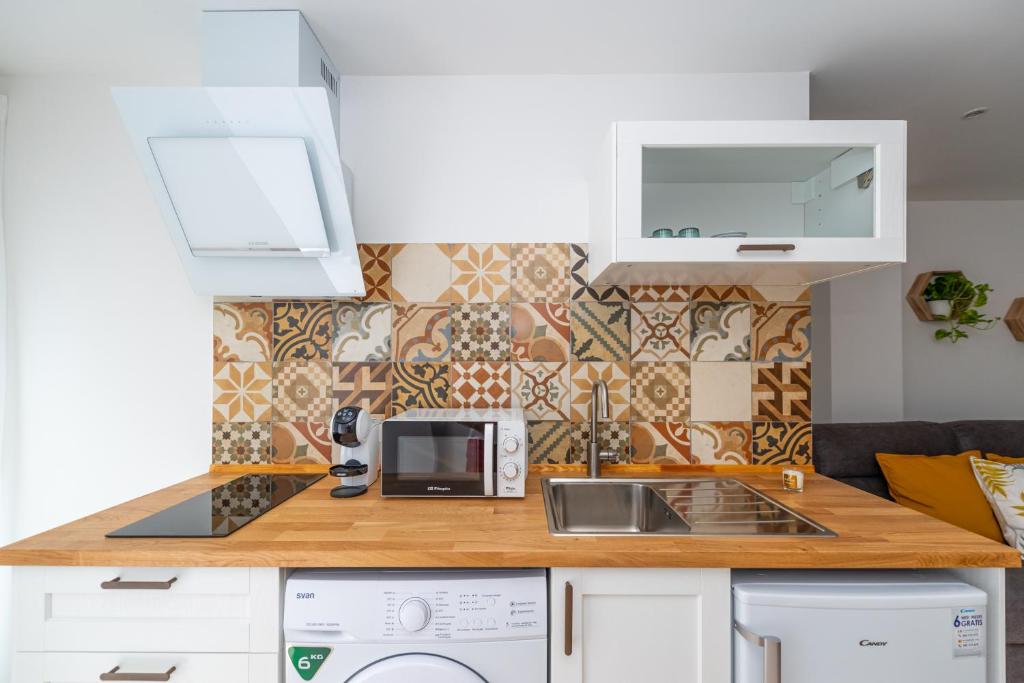 Kuchyň nebo kuchyňský kout v ubytování Apartamentos Manuel Roio
