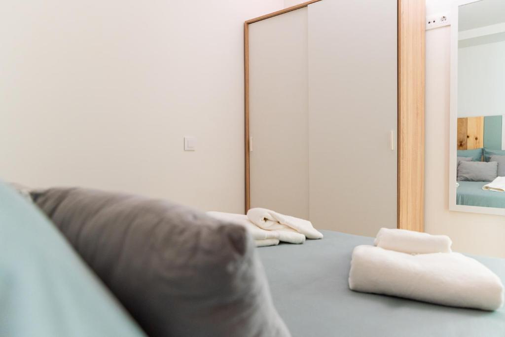 Postel nebo postele na pokoji v ubytování Apartamentos Manuel Roio