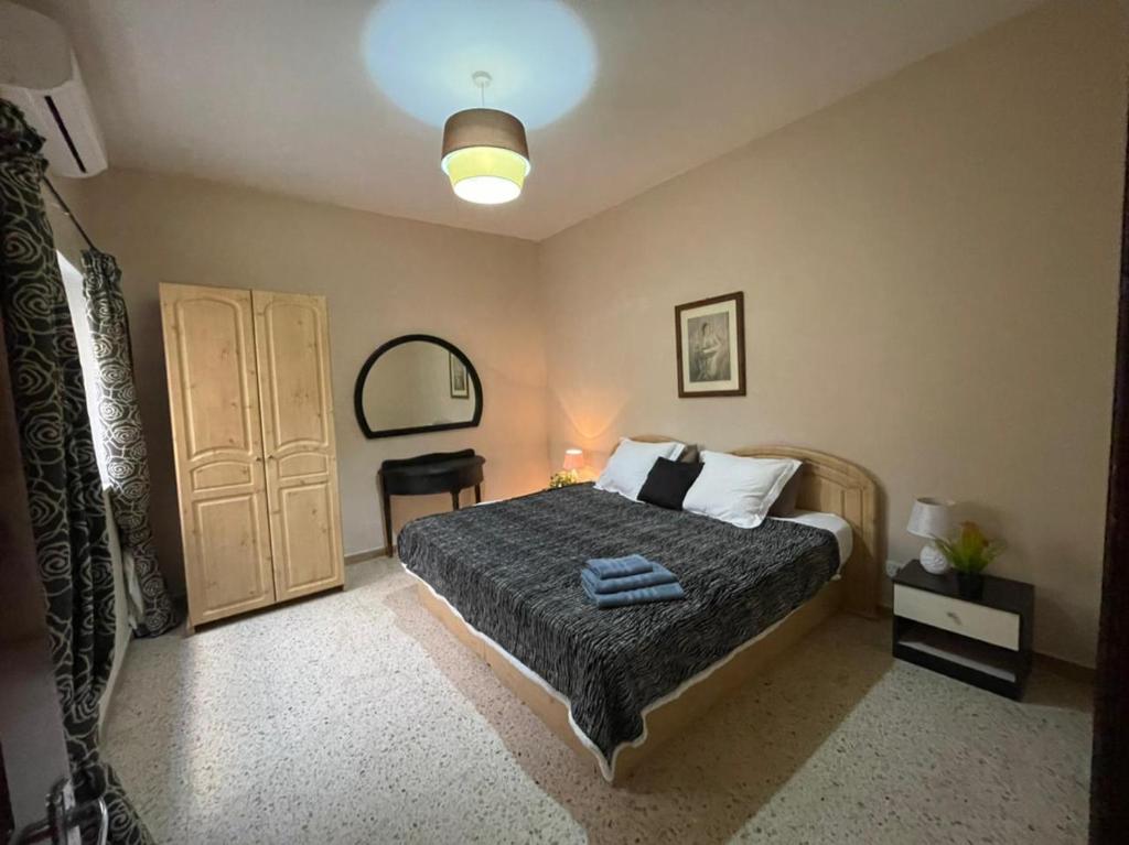 Кровать или кровати в номере Olivier House Mellieha