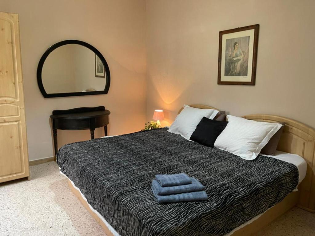 Кровать или кровати в номере Olivier House Mellieha