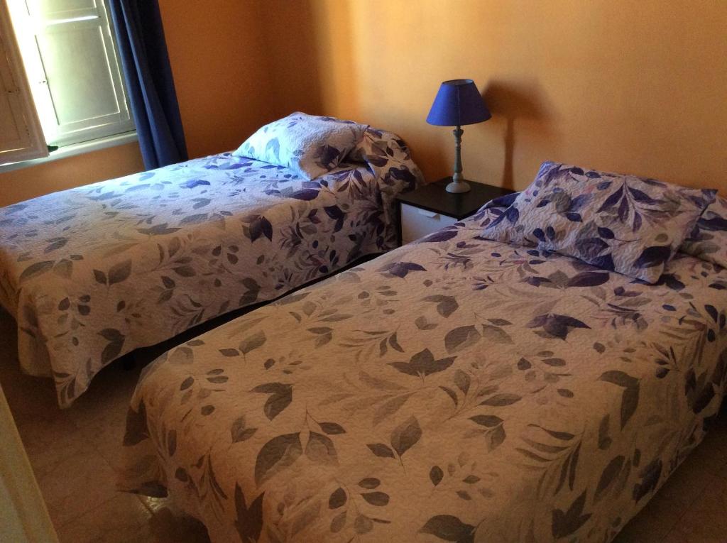 Krevet ili kreveti u jedinici u objektu Casa Garome 14 PARKING GRATIS